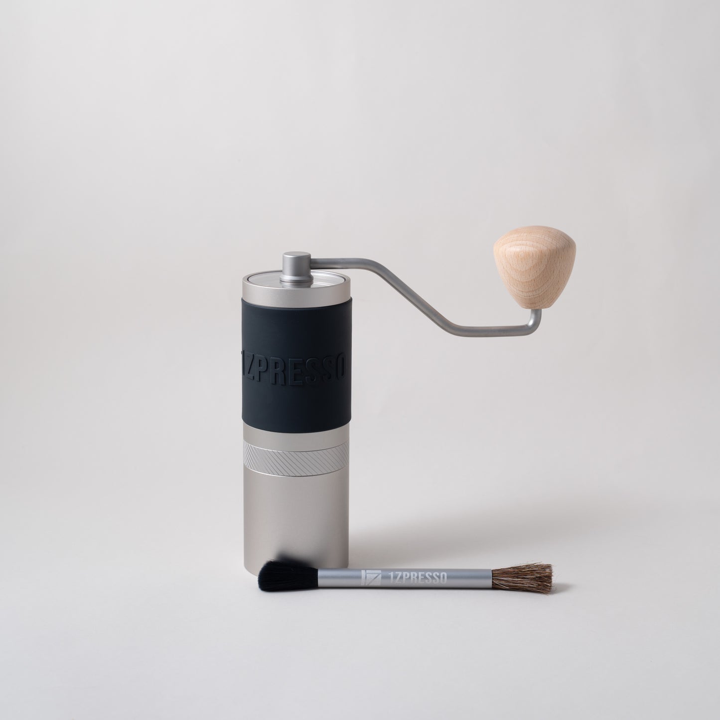 Hand grinders for filter coffee. Manual coffee grinder. Specialty coffee grinder. Black and silver with wooden handle.