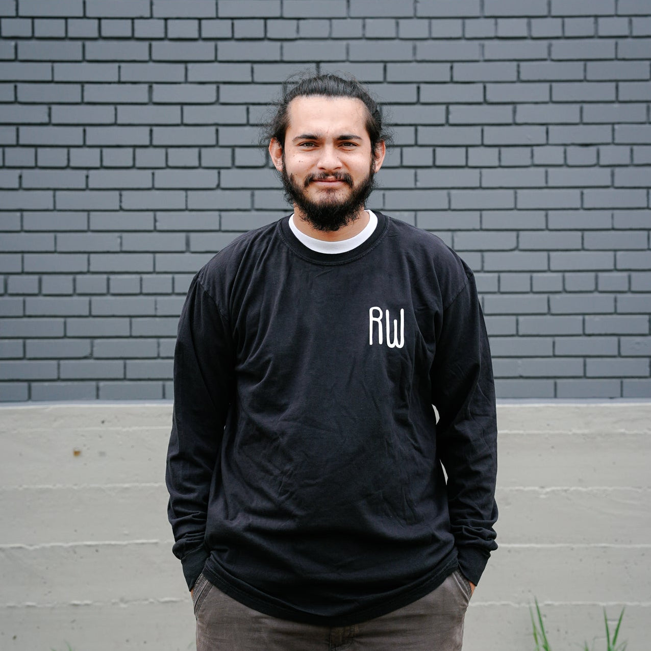 Aidan wearing a black longsleeve with RW on the front