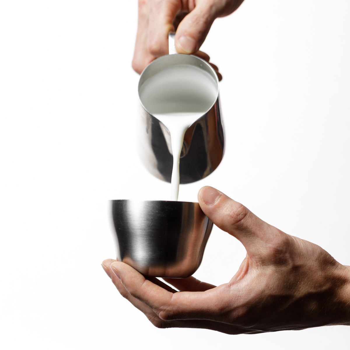 OREA STAC Cups with milk being poured in