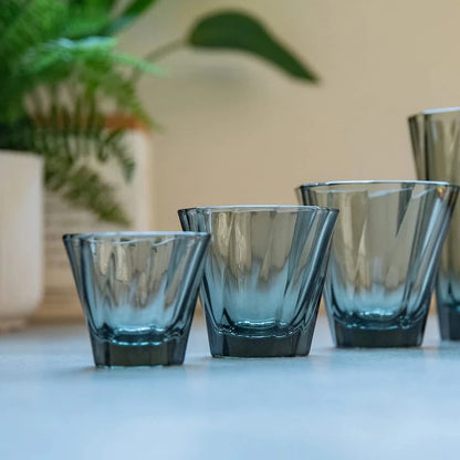 Glass is a great alternative material to our porcelain cups. It is a green, 100% recyclable, strong and non porous material. It has a thickness of 5mm, which retains heat extremely well. It has an interesting twisted exterior that refract light differently, with a curved interior that has the same feature as our porcelain cups. 